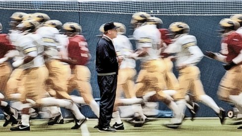 Bo Schembechler with his players during practice in October 1986 before the game that he won his 200th career victory. They are at the University of Michigan practice facility in Ann Arbor. Mary Schroeder Photos 28