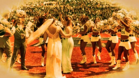 Sep 29, 2018; Lubbock, TX, USA; Kelsey Hohnstein and the Texas Tech Red Raiders pom squad celebrate during her wedding to Andrew Reinhart at half time of a game between the Texas Tech Red Raiders and the West Virginia Mountaineers at Jones AT&T Stadium. Mandatory Credit: Michael C. Johnson-USA TODAY Sports