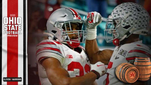 Jan 11, 2021; Miami Gardens, Florida, USA; Ohio State Buckeyes running back Master Teague III (33) celebrates with wide receiver Garrett Wilson (5) after scoring a touchdown during the first quarter against the Alabama Crimson Tide in the 2021 College Football Playoff National Championship Game.