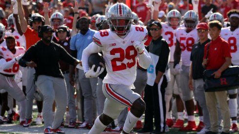 Denzel Burke returns an interception for a touchdown.