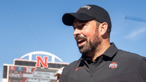 Nov 6, 2021; Lincoln, Nebraska, USA; Ohio State Buckeyes head coach Ryan Day (right) walks off the field in celebration after a win over the Nebraska Cornhuskers at Memorial Stadium. Mandatory Credit: Dylan Widger-USA TODAY Sports