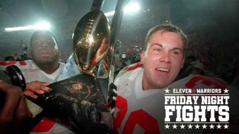 After winning the 1997 Rose Bowl OSU #65 Juan Porter and Greg Bellisari share passing around the Rose Bowl Trophy . Photo by Eric Albrecht 
