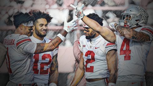 Ohio State Buckeyes wide receiver Jaxon Smith-Njigba (11) and Ohio State Buckeyes wide receiver Julian Fleming (4) celebrate after a play during Saturday's NCAA Division I football game against the Nebraska Cornhuskers at Memorial Stadium in Lincoln, Neb., on November 6, 2021. 
