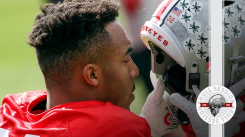 TreVeyon Henderson is putting on his helmet in today's skull session.