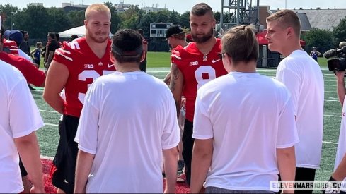 Tommy Eichenberg and Cade Stover talk to campers at the Special Skills Football Invitational.