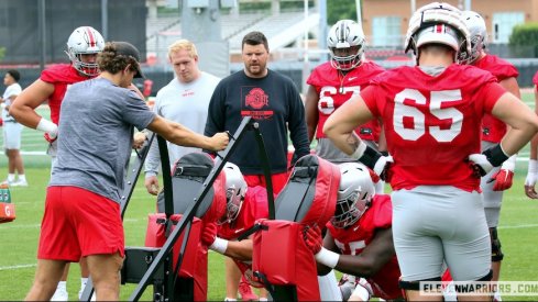 Justin Frye coaches offensive linemen at Ohio State’s second practice of preseason camp.