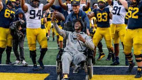 Dametrius Walker scores a touchdown in Michigan Stadium.