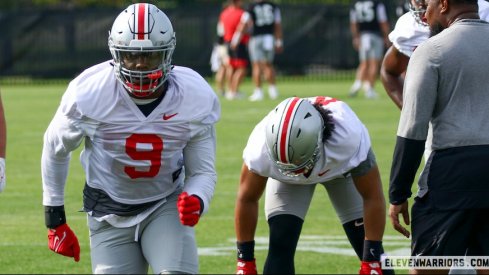 Zach Harrison and J.T. Tuimoloau going through defensive drills in practice.