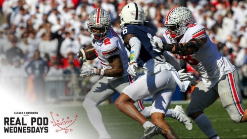 Emeka Egbuka getting tackled on a bubble screen