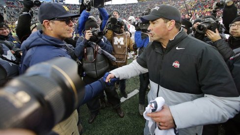 Jim Harbaugh and Ryan Day after Michigan’s win over Ohio State in 2021.