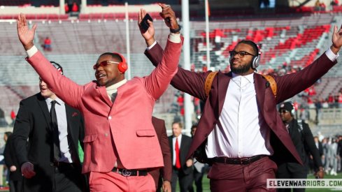 Mike Hall Jr. and Paris Johnson Jr. take the field before Ohio State's 2022 game with Michigan