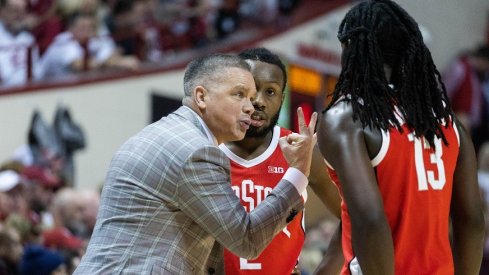 Chris Holtmann with Isaac Likekele and Bruce Thornton