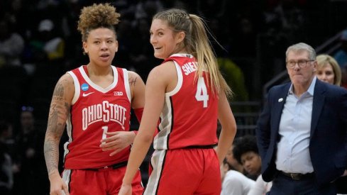 Rikki Harris and Jacy Sheldon celebrate Ohio State’s win in front of a sad Geno Auriemma.