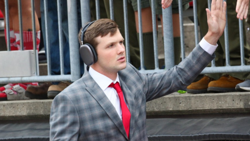 Ohio State quarterback Kyle McCord high fives fans