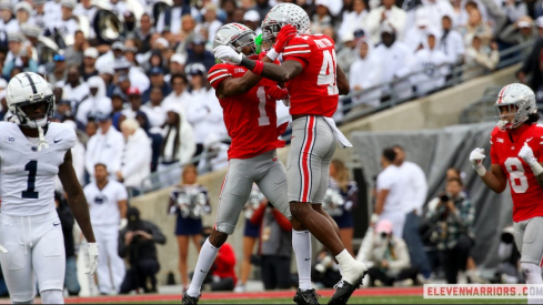 Josh Proctor and Davison Igbinosun celebrate vs. Penn State