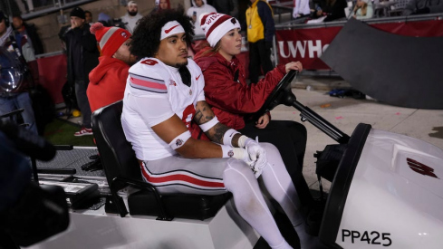 Lathan Ransom being carted back to the locker room