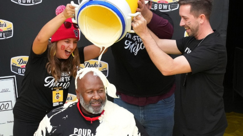 Mike Locksley celebrating the Mayo Bowl win