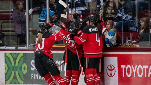 Ohio State women’s hockey celebrating its 7-0 win at Minnesota