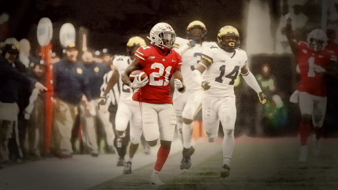 2018-Ohio State 62, Michigan 39 Ohio State Buckeyes wide receiver Parris Campbell Jr. (21) scores on a rushing touchdown as Michigan Wolverines head coach Jim Harbaugh points to the sideline thinking he stepped out in the 4th quarter of their game at Ohio Stadium in Columbus, Ohio on November 24, 2018.