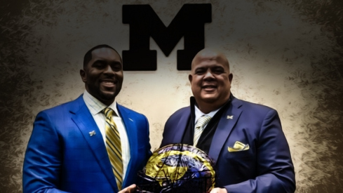 Sherrone Moore, head coach of the University of Michigan, stands next to Warde Manuel, Michigan s Director of Athletics, during a press conference inside the Junge Family Champions Center in Ann Arbor on Saturday, Jan. 27, 2024.