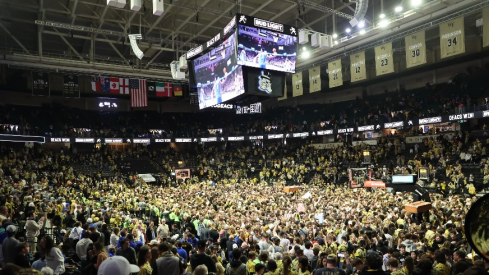 Wake Forest students storm the court at at Lawrence Joel Veterans Memorial Coliseum after upsetting the Duke Blue Devils