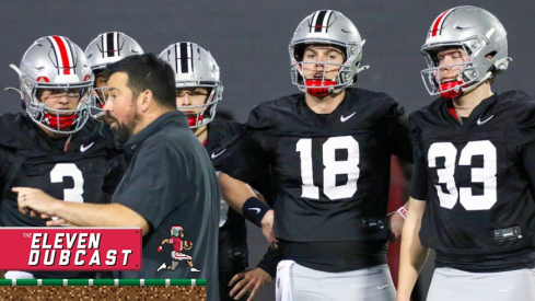 Ohio State quarterback room takes direction from head coach Ryan Day at spring practice.