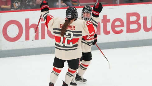 Jenn Gardiner celebrates a goal with Cayla Barnes during Ohio State’s Feb. 17 win over St. Thomas.