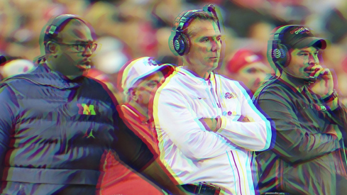 Sep 22, 2018; Columbus, OH, USA; Ohio State Buckeyes head coach Urban Meyer (center) watches the game from the sidelines with assistant coach Ryan Day (right) and assistant coach Tony Alford (left) during the third quarter against the Ohio State Buckeyes at Ohio Stadium. Mandatory Credit: Joe Maiorana-USA TODAY Sports