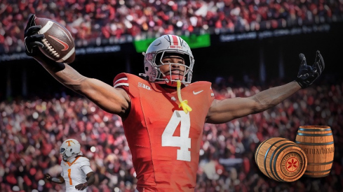 Ohio State wide receiver Jeremiah Smith (4) celebrates a touchdown against Michigan during the first half at Ohio Stadium in Columbus, Ohio on Saturday, Nov. 30, 2024.