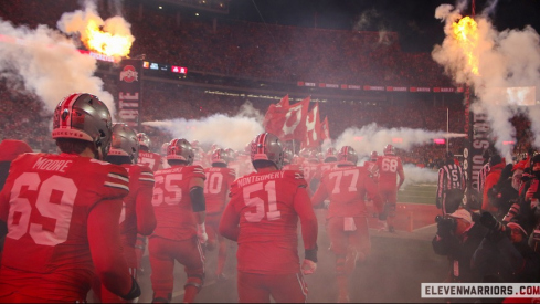 Ohio State players running into Ohio Stadium before the CFP game vs. Tennessee