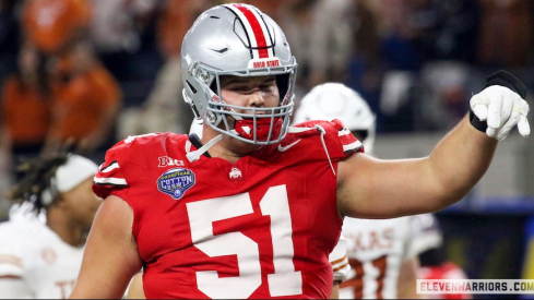 Luke Montgomery flashing the “Horns Down” during Ohio State’s 2024 Cotton Bowl win over Texas.