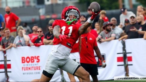 Brandon Inniss catching a pass in front of fans during 2024 preseason camp