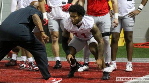 C.J. Hicks working on pass-rush drills with Larry Johnson