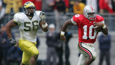 Troy Smith running away from Michigan’s LaMarr Woodley in 2004