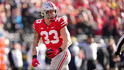 Jack Sawyer picks up a fumble vs. Michigan in 2022