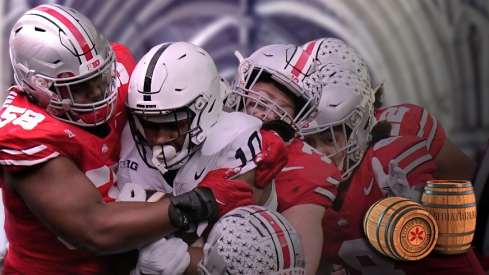Oct 21, 2023; Columbus, Ohio, USA; Ohio State Buckeyes defensive tackle Ty Hamilton (58) bottles up Penn State Nittany Lions running back Nicholas Singleton (10) during the first half of the NCAA football game at Ohio Stadium.