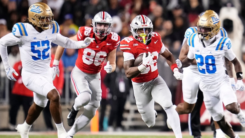 Isaiah West running through the UCLA defense
