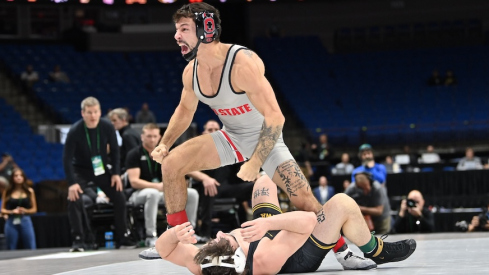 Nic Bouzakis celebrating his pin of Iowa’s Dean Peterson