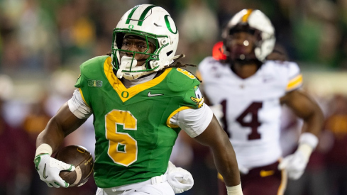 Oregon’s Noah Whittington scoring a touchdown vs. Minnesota