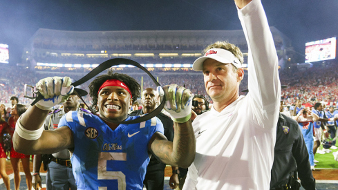 Mississippi Rebels running back Kewan Lacy (5) and head coach Lane Kiffin react after defeating the Florida Gators