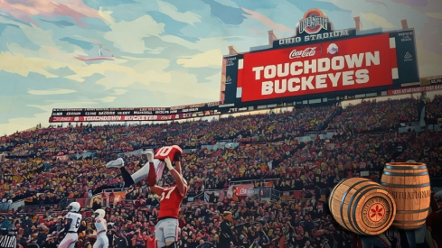 austin siereveld lifts up julian sayin after an ohio state touchdown against penn state in 2025