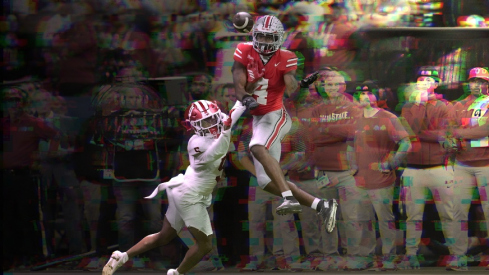 Ohio State Buckeyes wide receiver Jeremiah Smith (4) catches a pass in front of Indiana Hoosiers defensive back D'Angelo Ponds (5) on Saturday, Dec. 6, 2025, during the Big Ten football championship at Lucas Oil Stadium in Indianapolis.