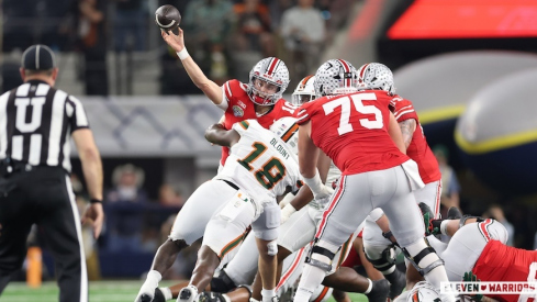 Julian Sayin getting hit as he throws by Miami’s Armondo Blount 