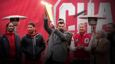 Ohio State coach Ryan Day hoists the championship trophy during the school's national championship celebration at Ohio Stadium in Columbus on Jan. 26, 2025.