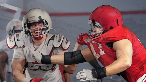 Ohio State Buckeyes defensive end Beau Atkinson (12) fights past defensive tackle Sam Greer (77) during Student Appreciation Day spring practice at the Woody Hayes Athletic Center on April 4, 2026.