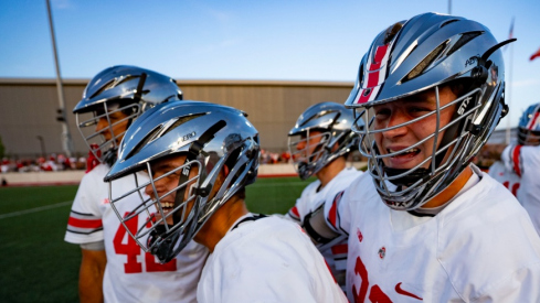 Ohio State men's lacrosse celebrates a last-second win over Michigan.