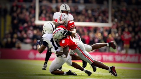 Ohio State Buckeyes linebacker Arvell Reese (8) and linebacker Sonny Styles (0) tackle Penn State Nittany Lions running back Nicholas Singleton (10) in the second half of the college football game at Ohio Stadium on Saturday, Nov. 1, 2025 in Columbus, Ohio.