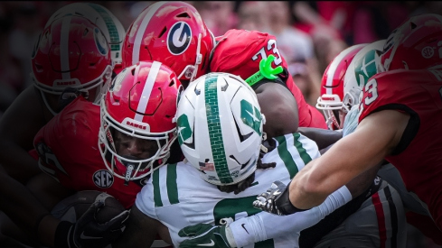 Nov 22, 2025; Athens, Georgia, USA; Georgia Bulldogs running back Nate Frazier (3) runs over Charlotte 49ers defensive back Randy Franklin (0) for a touchdown during the first quarter at Sanford Stadium. Mandatory Credit: Dale Zanine-Imagn Images