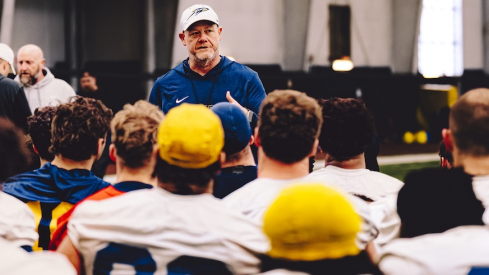 Mike Jacobs speaking to his team at a Toledo practice