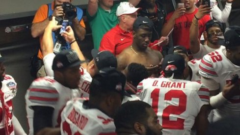Ohio State's Doran Grant gets down to Shy Glizzy in the locker room after the Buckeyes 42–35 win over Alabama in the Sugar Bowl.